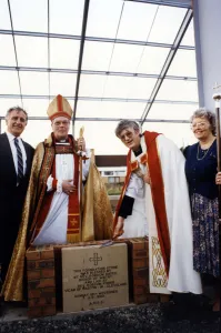 The Rev Gordon Fisher lays the foundation, watched by the Rt Rev Bates The Rev Gordon Fisher lays the foundation, watched by the Rt Rev Bates