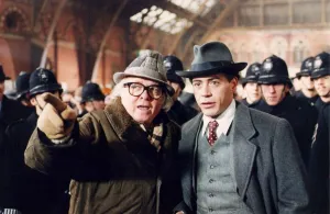 Richard Attenborough with Robert Downey Jnr and extras on station set of film Charlie Richard Attenborough with Robert Downey Jnr and extras on station set of film Charlie
