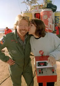 Richard Branson is kissed by one of the ground crew Virgin Global Challenger balloon Richard Branson is kissed by one of the ground crew Virgin Global Challenger balloon