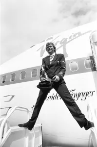 Richard Branson seen here dressed as a Virgin Atlantic pilots with a bottle of champagne Richard Branson seen here dressed as a Virgin Atlantic pilots with a bottle of champagne