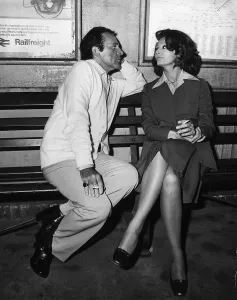 Richard Burton with Sophia Loren on a bench at a train station filming the play brief Richard Burton with Sophia Loren on a bench at a train station filming the play brief