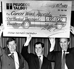 Images Dated 15th February 1989: Richard Parham(right), assistant MD at Peugeot get help with the oversized cheque