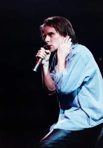 Ricky Ross singer rock band pop group Deacon Blue on stage holding microphone May Ricky Ross singer rock band pop group Deacon Blue on stage holding microphone May