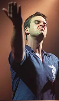 Robbie Williams makes a face to the audience at his concert at the SECC Glasgow February Robbie Williams makes a face to the audience at his concert at the SECC Glasgow February