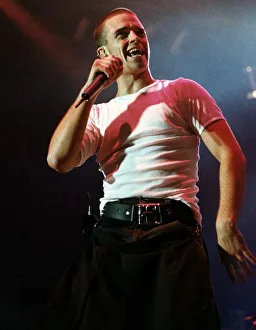 Robbie Williams performing on stage during the the first night concert of Take That at Robbie Williams performing on stage during the the first night concert of Take That at