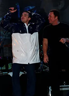 Robbie Williams and Tom Jones February 1998 Rehearsing on stage for the Brit Awards Robbie Williams and Tom Jones February 1998 Rehearsing on stage for the Brit Awards
