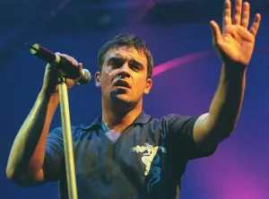 Robbie Williams waves to the audience at his concert at the SECC Glasgow February 1999 Robbie Williams waves to the audience at his concert at the SECC Glasgow February 1999