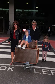 Rod Stewart Singer April 98 Arriving at Heathrow with his wife Rachel Hunter Rod Stewart Singer April 98 Arriving at Heathrow with his wife Rachel Hunter