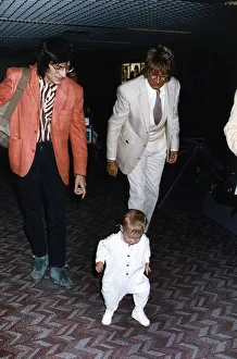 Rod Stewart singer songwriter with Ronnie Wood escorts baby daughter Renee through Rod Stewart singer songwriter with Ronnie Wood escorts baby daughter Renee through
