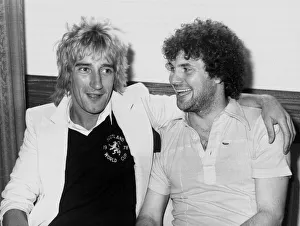 Rod Stewart with striker Derek Johnstone. The pop superstar called in on the Scottish Rod Stewart with striker Derek Johnstone. The pop superstar called in on the Scottish