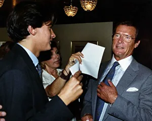 Roger Moore Actor James Bond with wife Luisa and son Geoffrey at a Variety Club tribute Roger Moore Actor James Bond with wife Luisa and son Geoffrey at a Variety Club tribute