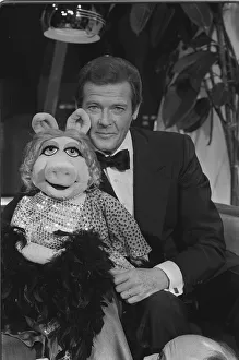 Roger Moore meets Miss Piggy from the Muppets 80-2307 Box 29 Date 1 Roger Moore meets Miss Piggy from the Muppets 80-2307 Box 29 Date 1