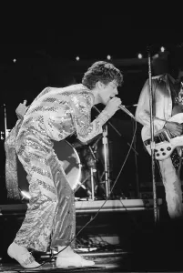 The Rolling Stones. Mick Jagger sings on stage with the Stones during a concert at The Rolling Stones. Mick Jagger sings on stage with the Stones during a concert at