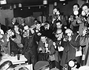 A room full of photographers take pictures of pop group The Beatles during their visit to A room full of photographers take pictures of pop group The Beatles during their visit to