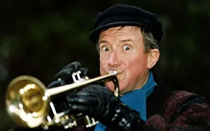 Roy Castle TV Presenter and Entertainer plays a trumpet to celebrate his OBE honours in Roy Castle TV Presenter and Entertainer plays a trumpet to celebrate his OBE honours in