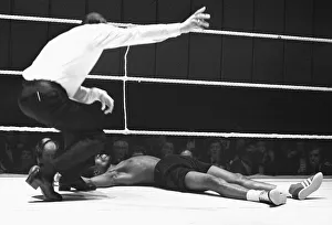 Roy Gumbs being counted out by the referee after being knocked out by Eddie Smith at Roy Gumbs being counted out by the referee after being knocked out by Eddie Smith at