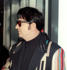 Roy Orbison at Heathrow Airport November 1988 in multi coloured coat Roy Orbison at Heathrow Airport November 1988 in multi coloured coat