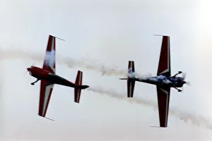 Royal Jordanian Falcons display team performing in their Extra EA300 aircraft at Royal Jordanian Falcons display team performing in their Extra EA300 aircraft at