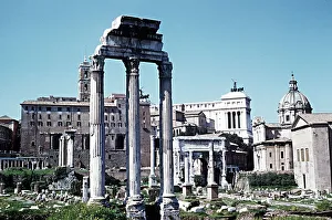 Ruins of the Temple of Castor and Pollux looking towards Arch of Septimius Severus Italy Ruins of the Temple of Castor and Pollux looking towards Arch of Septimius Severus Italy