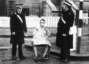 Runner in the London Marathon March 1981 being helped by members of the St Runner in the London Marathon March 1981 being helped by members of the St