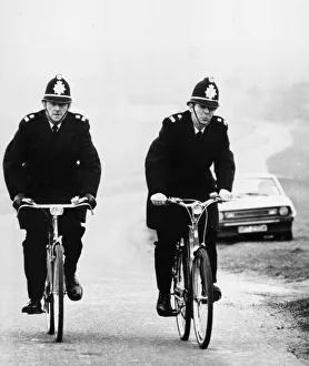 Two rural Police constables doing their rounds on bicycle at Newmarket, Cambridgeshire Two rural Police constables doing their rounds on bicycle at Newmarket, Cambridgeshire