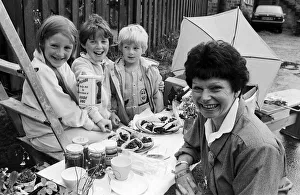 Sales talk... These two Golcar sisters and their brother held a stall for bric-a-brac Sales talk... These two Golcar sisters and their brother held a stall for bric-a-brac