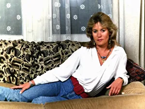 Sally Knyvette actress lying on sofa at her home April 1989 Sally Knyvette actress lying on sofa at her home April 1989