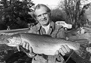 Sam Holland proudly holding one of his specially bread super trouts at his fishery at Sam Holland proudly holding one of his specially bread super trouts at his fishery at