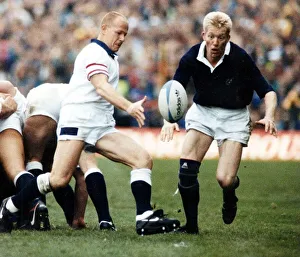Scotland Rugby player John Jeffrey watches as England scrum half clers the ball from a Scotland Rugby player John Jeffrey watches as England scrum half clers the ball from a