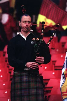 A Scottish fan plays the bagpipes at the end of the Scotland v England match which A Scottish fan plays the bagpipes at the end of the Scotland v England match which