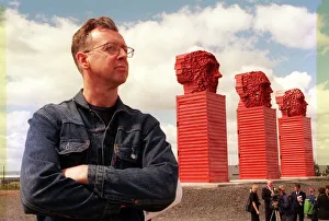 Sculptor David Mach June 1999 beside his Big Heids sculpture alongside the A8 Sculptor David Mach June 1999 beside his Big Heids sculpture alongside the A8