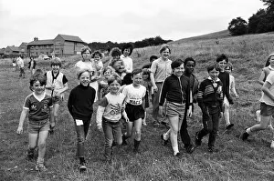 Setting off on a sponsored walk from Rodger Lane are youngsters Setting off on a sponsored walk from Rodger Lane are youngsters