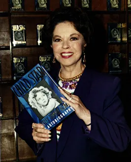 Shirley Temple actress holding up a copy of her book Child Star May 1989 Shirley Temple actress holding up a copy of her book Child Star May 1989