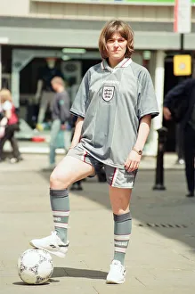 Shop asistant Karen Burke from Soccer City, models England's Grey Strip, Liverpool Shop asistant Karen Burke from Soccer City, models England's Grey Strip, Liverpool