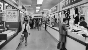 Shoppers browsing in Manchester's High Street Market. 10th July 1985 Shoppers browsing in Manchester's High Street Market. 10th July 1985