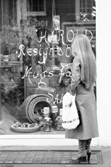 Shoppers in Crawford Street, Marylebone, London looks at the window display of Briglin Shoppers in Crawford Street, Marylebone, London looks at the window display of Briglin