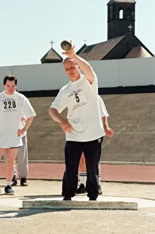 Shot put at the annual sports day at Clairville Stadium for people with special needs Shot put at the annual sports day at Clairville Stadium for people with special needs
