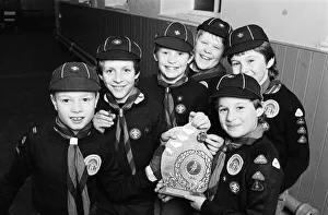 Showing off the shield they won in a five-a-side football competition are these members Showing off the shield they won in a five-a-side football competition are these members