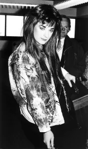 Singer Boy George wearing a long wig and a coat covered with safety pins Singer Boy George wearing a long wig and a coat covered with safety pins