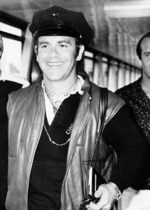 Singer, Elton John, arriving at London Airport from Nice. 29th July 1980 Singer, Elton John, arriving at London Airport from Nice. 29th July 1980