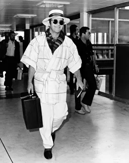 Singer Elton John pictured at Heathrow airport. 11th April 1982 Singer Elton John pictured at Heathrow airport. 11th April 1982