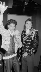 Singer Michael Jackson looking at a waxwork model of himself on display at madame Singer Michael Jackson looking at a waxwork model of himself on display at madame
