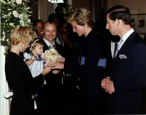 Singer and msusician Phil Collins with his family meeting Prince Charles Singer and msusician Phil Collins with his family meeting Prince Charles
