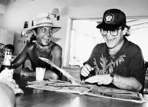 Singer and songwriter Elton John with his co-star lyricist Bernie Taupin seems happy once Singer and songwriter Elton John with his co-star lyricist Bernie Taupin seems happy once