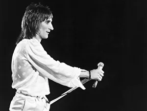 Singer songwriter Rod Stewart on stage in concert. According to Dee Harrington Rod was a Singer songwriter Rod Stewart on stage in concert. According to Dee Harrington Rod was a