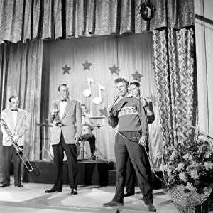 Singer Tommy Steel seen here performing. 1957 A397-003 Singer Tommy Steel seen here performing. 1957 A397-003
