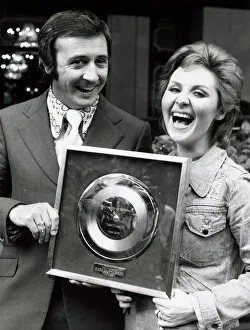 Singer Tony Christie with pop singer Lulu wins award for a million sales of his hit Is Singer Tony Christie with pop singer Lulu wins award for a million sales of his hit Is