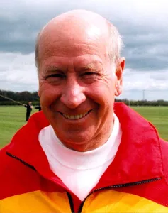 Sir Bobby Charlton gives tips to youngsters on Bullocksteads Sports Ground in May 1996 in Sir Bobby Charlton gives tips to youngsters on Bullocksteads Sports Ground in May 1996 in