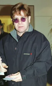Sir Elton John December 1999 leaves Heathrow Airport for Los Angeles Sir Elton John December 1999 leaves Heathrow Airport for Los Angeles