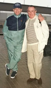 Sir Elton John leaving Heathrow on his way March 1998 to Australia with manager Sir Elton John leaving Heathrow on his way March 1998 to Australia with manager